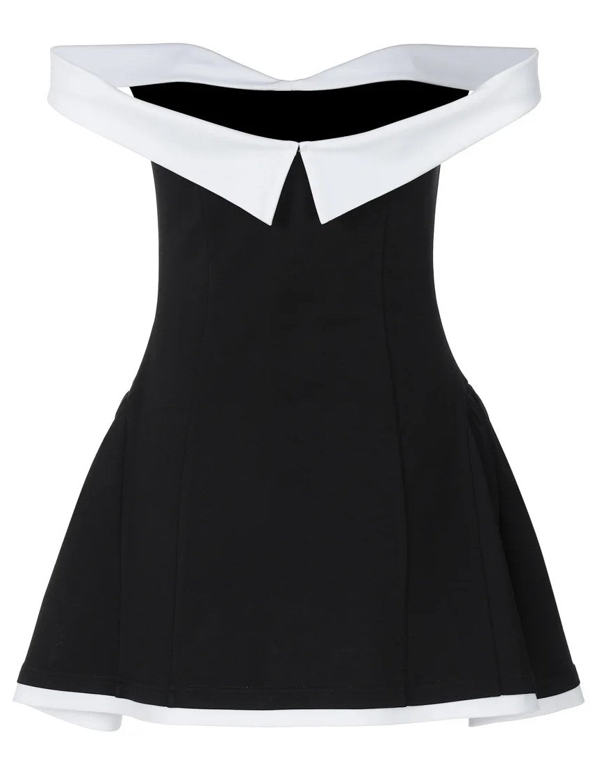 Back view of a black and white off-shoulder mini dress on display, showcasing its structured, classy fit.